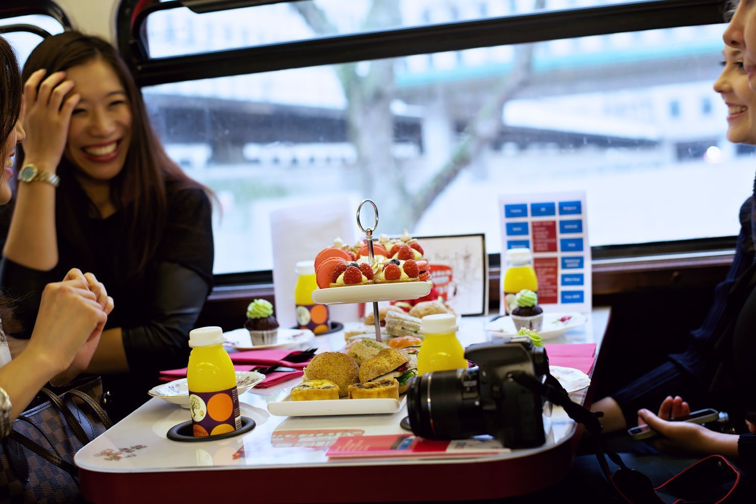 Bloggers enjoying the afternoon tea on the BB Bakery 60s double decker bus