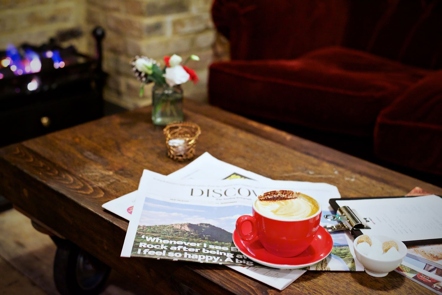 The lounge and fireplace at the Artist Residence hotel in London