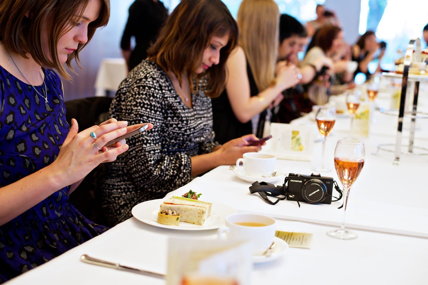 London bloggers instagraming their food at the #LDNBloggersTea at the Lancaster London Hotel