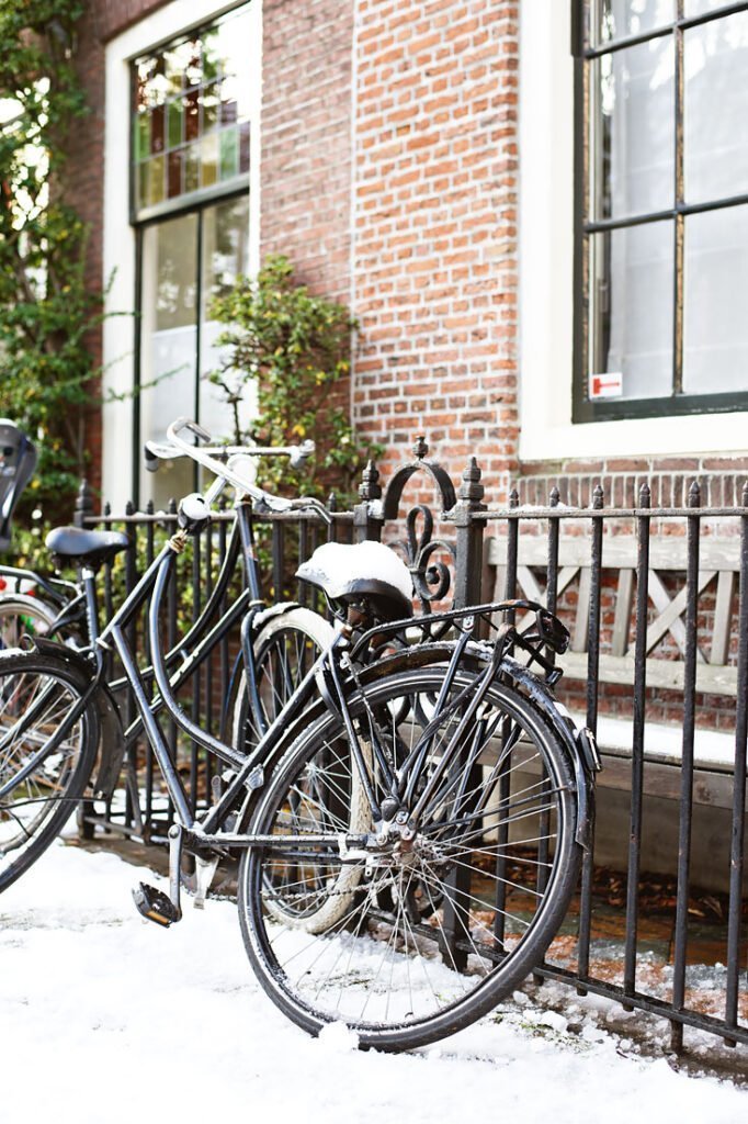 Bike covered in snow in Delft