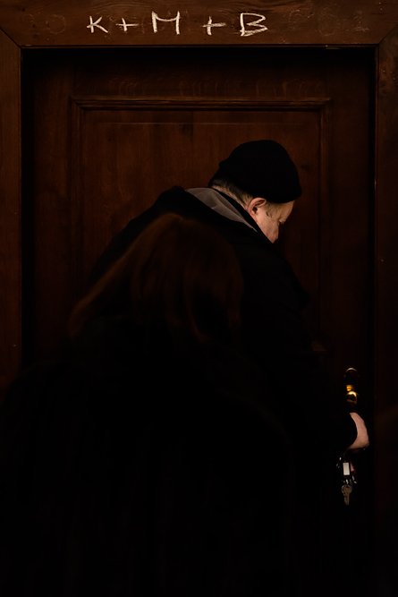Monk opening the door to the monastery library at the Augustinian St Thomas Monastery. Augustine, a Luxury Collection Hotel in Prague.