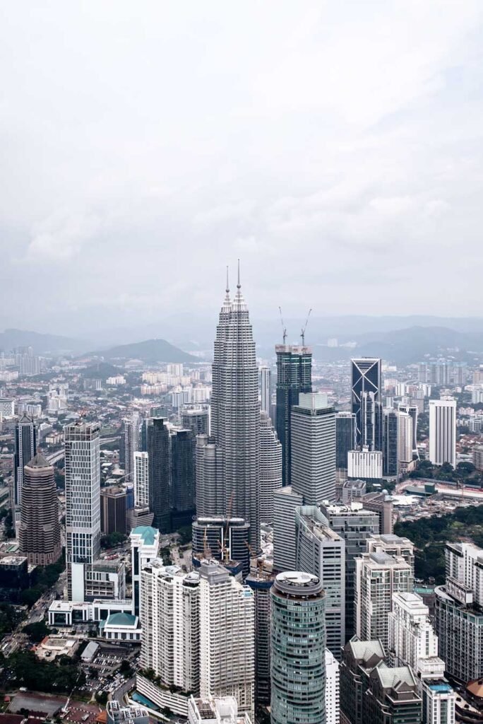 How to spend 3 amazing days in Kuala Lumpur, Malaysia - Skyline with the Petronas Towers from the Menara Kuala Lumpur Tower