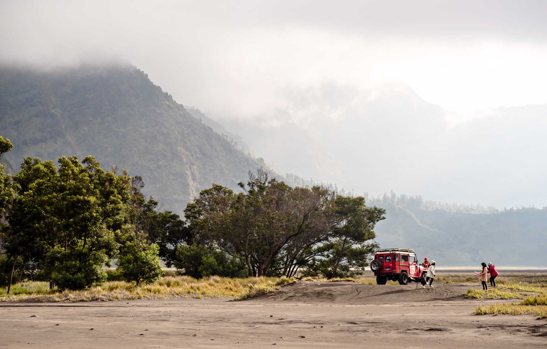 Girls taking a picture in front of Mount Bromo. Read the review of my Mount Bromo Tour: Climbing an active volcano in East Java, Indonesia on Urban Pixxels.