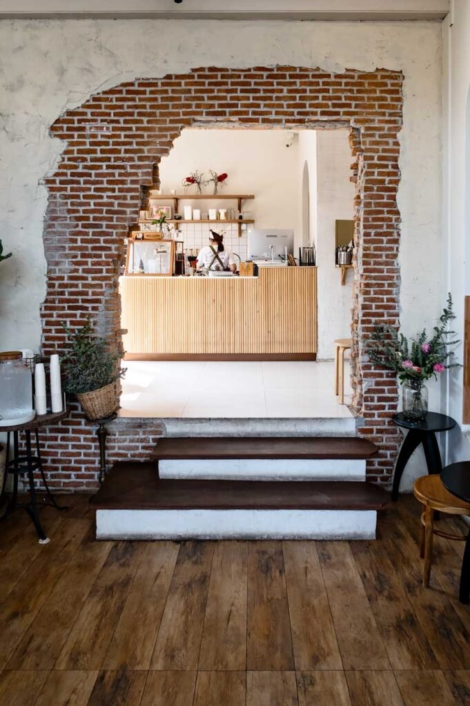 Cheevit Cheeva, a dessert cafe in Chiang Mai with a cool brick wall.