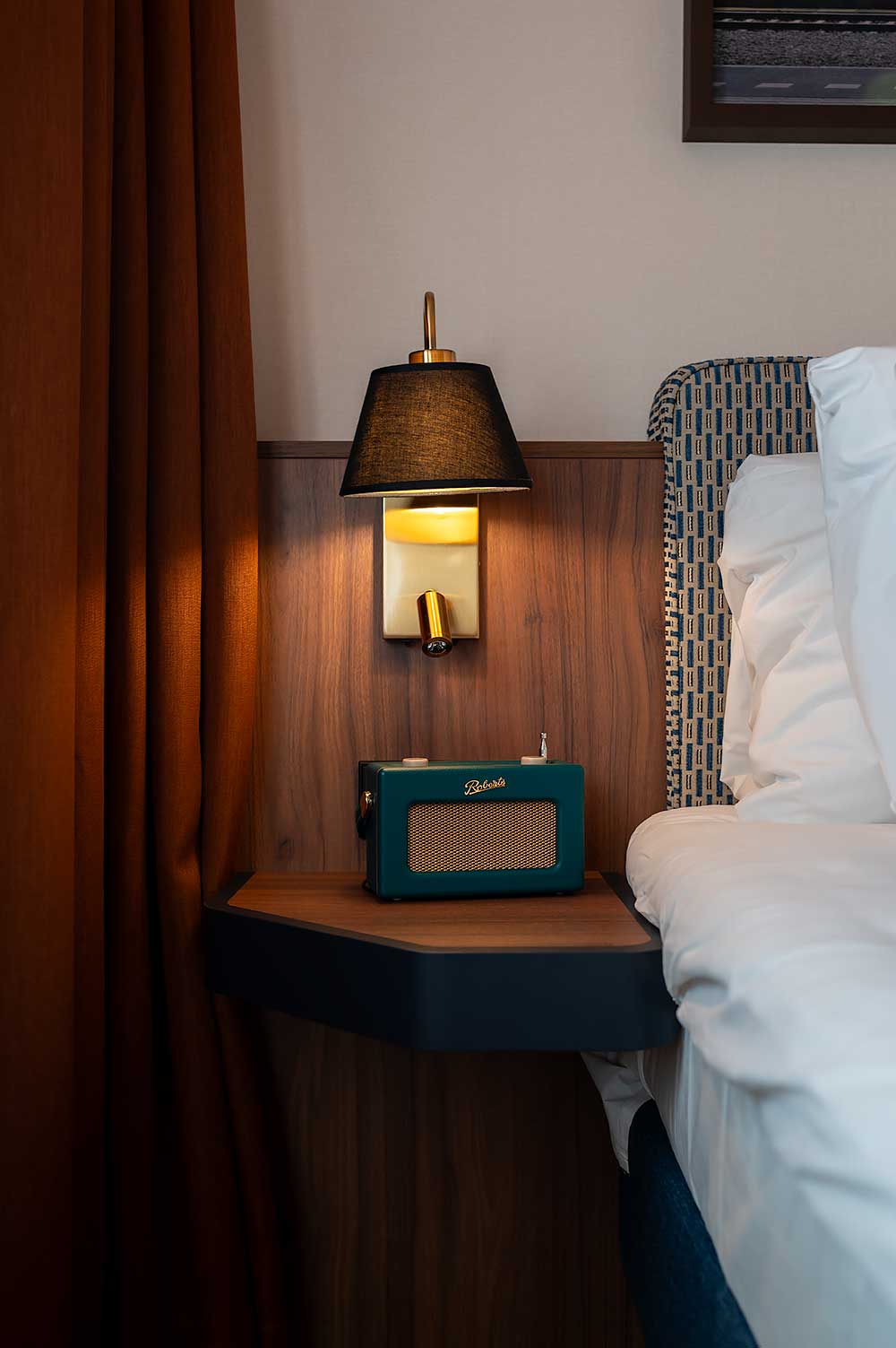 DeLuxe Suite at hotel De Plesman in The Hague with retro radio on the nightstand
