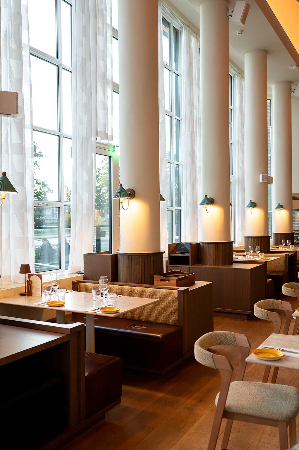 Restaurant Suus with seats by the window at hotel De Plesman in The Hague