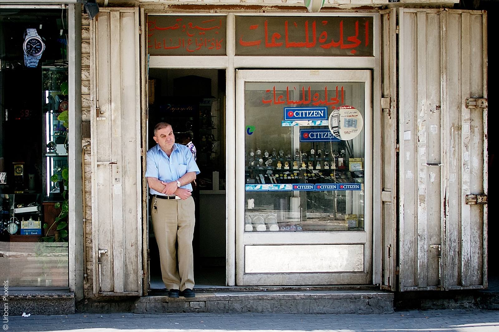Palestinian man watching people in Ramallah | Urban Pixxels
